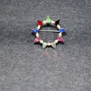 vintage costume jewelry B. David multi colored crystal silver tone circle brooch